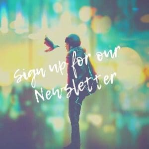 Sign Up for Our Newsletter Image: A whimsical, soft-focus image of a child feeding a bird, with colorful bokeh lights in the background. The overlay text reads "Sign up for our Newsletter."