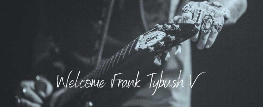 Person playing guitar in black and white with Welcome Frank Tybush V written in a type of cursive