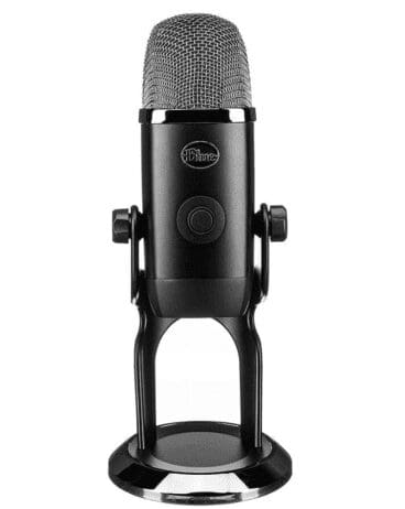 A black Blue Yeti microphone on a stand. The microphone has a cylindrical design with a mesh grille on top, a central button on the front, and the "Blue" logo above the button. The microphone is mounted on a sturdy metal stand designed for desktop use.