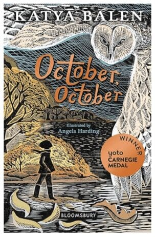 Cover of the book 'October, October' by Katya Balen, illustrated by Angela Harding. The cover features an autumnal scene with a young girl walking by a lake, surrounded by golden trees. Above the girl, a large, detailed illustration of an owl spreads its wings across the sky. The title 'October, October' is written in bold, orange script in the center of the cover. A round, orange sticker on the right side indicates that the book is a winner of the Yoto Carnegie Medal. The overall style of the cover is reminiscent of woodcut illustrations, with intricate lines and textures that evoke a sense of nature and the changing seasons. The publisher, Bloomsbury, is noted at the bottom.